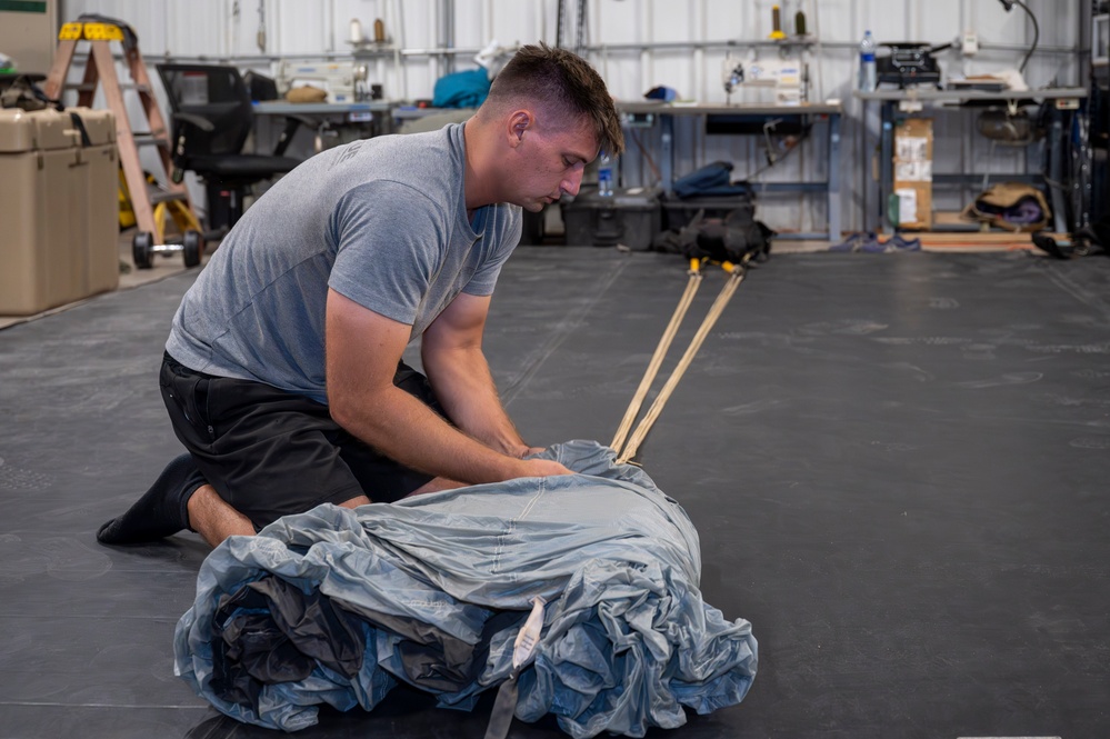 82nd Expeditionary Rescue Squadron Aircrew Flight Equipment Parachute Rigger Maintains Mission Readiness