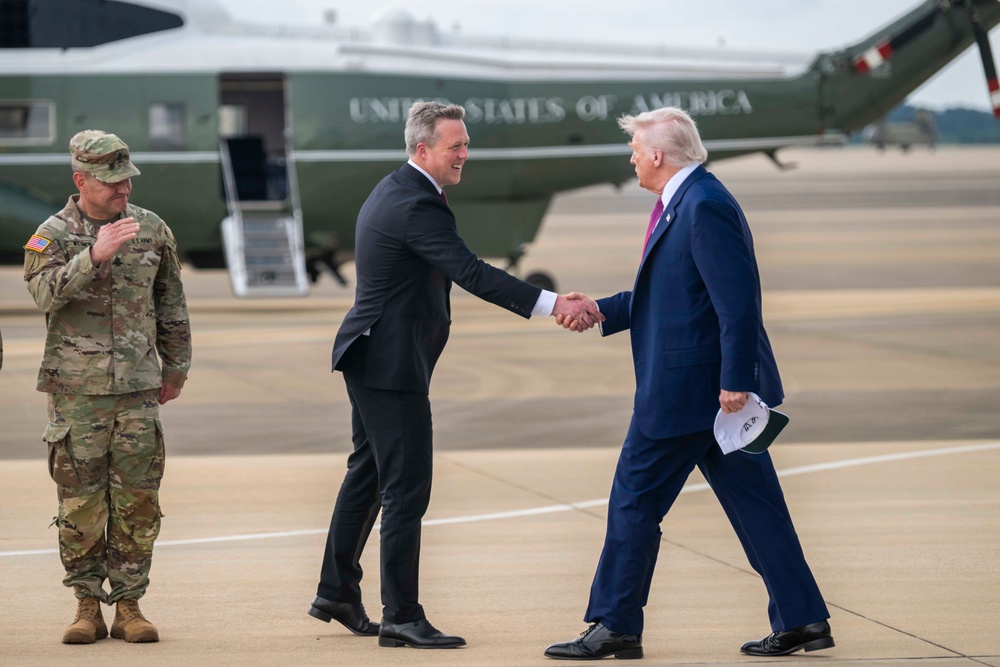 Secretary of the Army, Hon. Dan Driscoll, shakes the hand of U.S. President Donald J. Trump as he arrives at Fort Bragg