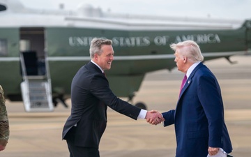 Secretary of the Army, Hon. Dan Driscoll, shakes the hand of U.S. President Donald J. Trump as he arrives at Fort Bragg