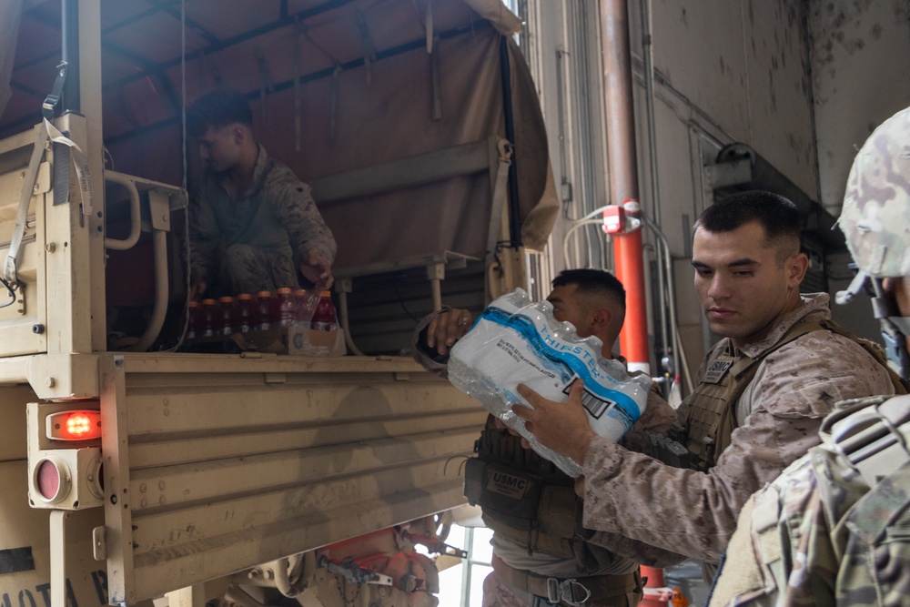 U.S. Marines distribute food delivered by California Army National Guard U.S. Marines distribute food delivered by California Army National Guard