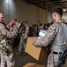 U.S. Marines distribute food delivered by California Army National Guard