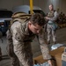 U.S. Marines distribute food delivered by California Army National Guard