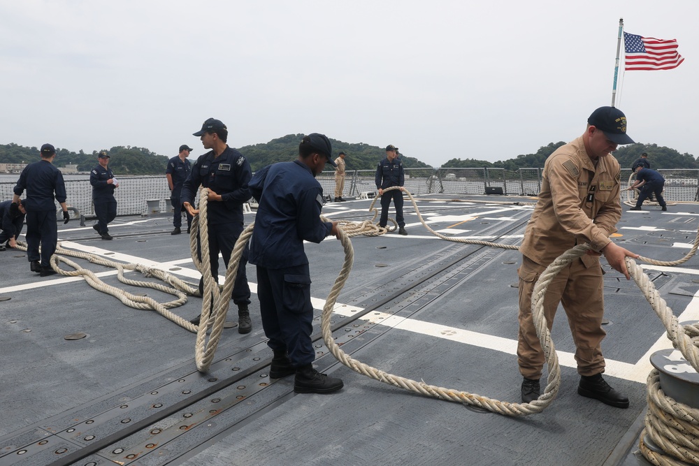 Sailors aboard the USS John Finn conduct a sea and anchor detail in Yokosuka, Japan
