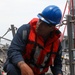 Sailors aboard the USS John Finn conduct a sea and anchor detail in Yokosuka, Japan