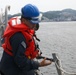 Sailors aboard the USS John Finn conduct a sea and anchor detail in Yokosuka, Japan