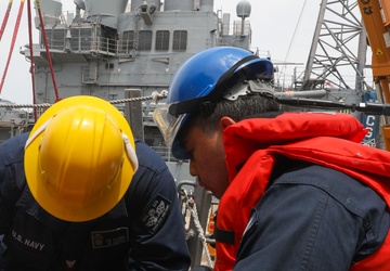 Sailors aboard the USS John Finn conduct a sea and anchor detail in Yokosuka, Japan
