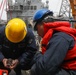 Sailors aboard the USS John Finn conduct a sea and anchor detail in Yokosuka, Japan