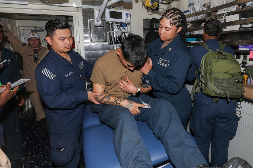 Sailors aboard the USS John Finn conduct a medical training team drill in Sagami Wan