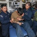 Sailors aboard the USS John Finn conduct a medical training team drill in Sagami Wan