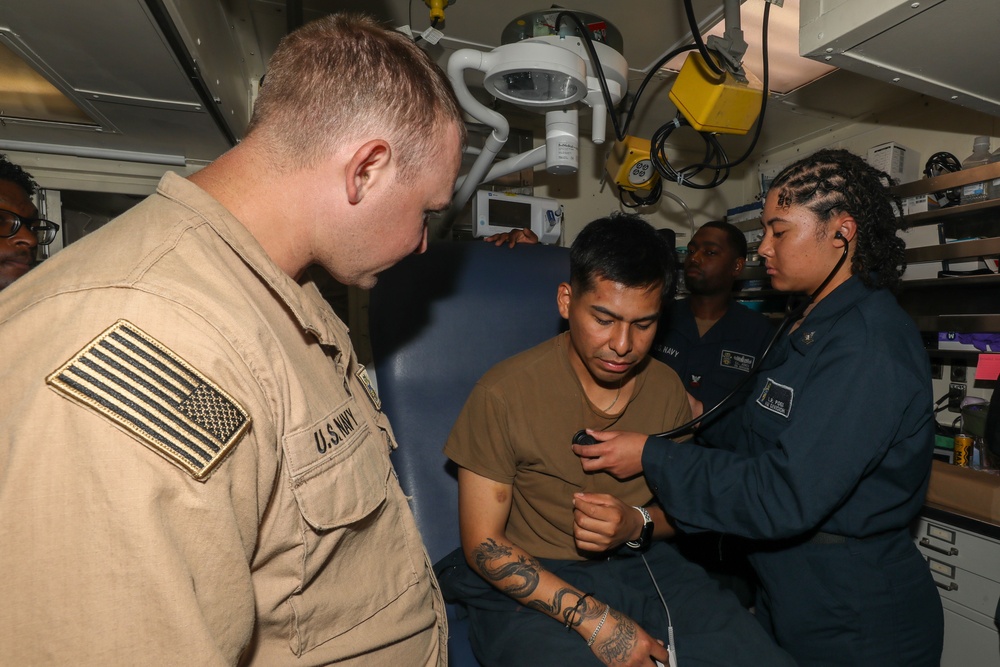 Sailors aboard the USS John Finn conduct a medical training team drill in Sagami Wan