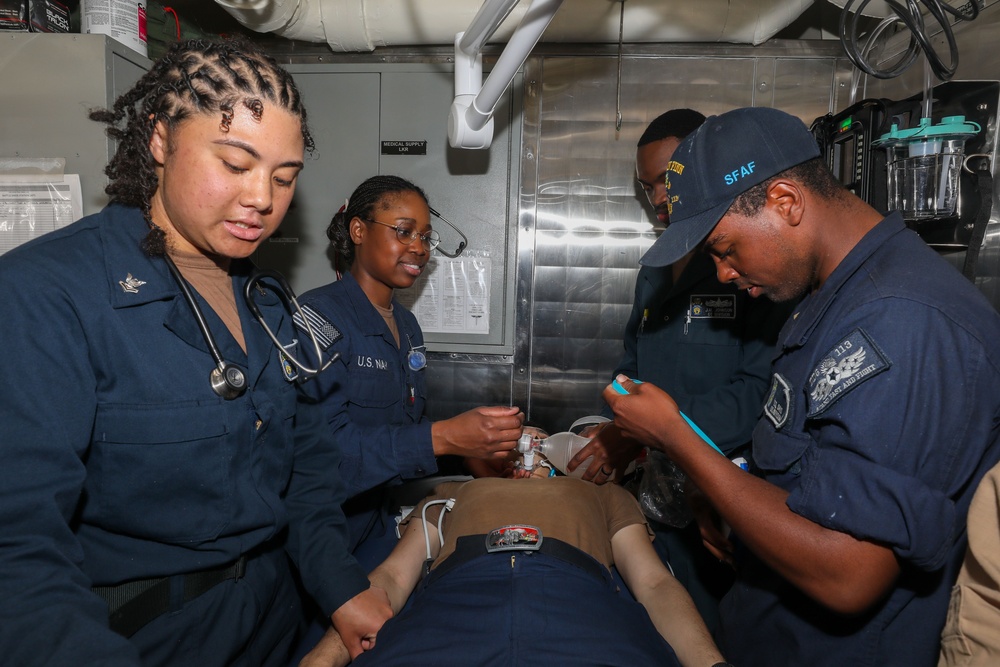 Sailors aboard the USS John Finn conduct a medical training team drill in Sagami Wan
