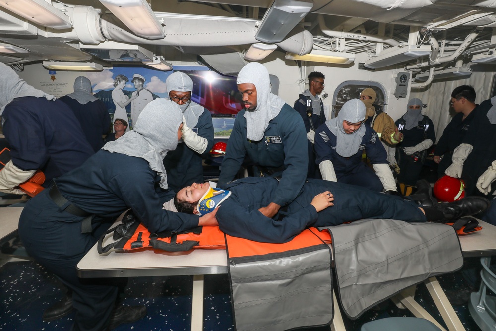 Sailors aboard the USS John Finn conduct a medical training team drill in Sagami Wan