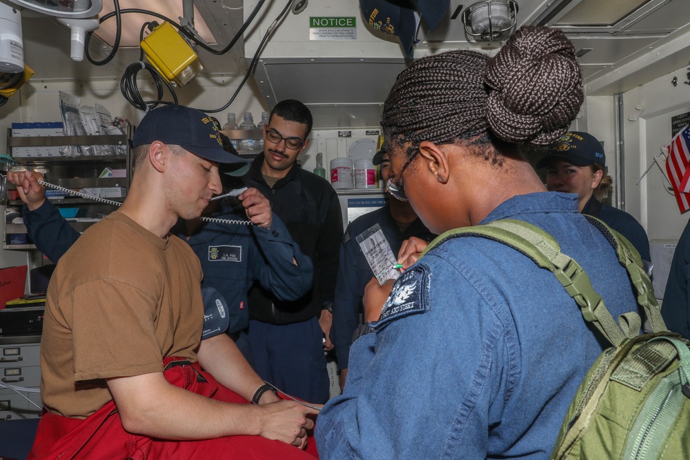 Sailors aboard the USS John Finn conduct a medical training team drill in Sagami Wan