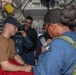 Sailors aboard the USS John Finn conduct a medical training team drill in Sagami Wan