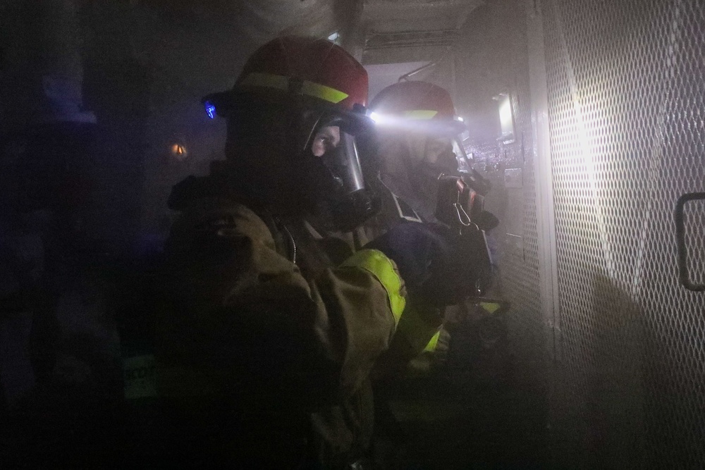 Sailors aboard the USS John Finn conduct a medical training team drill in Sagami Wan
