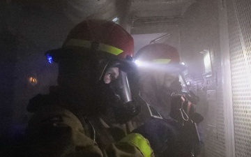 Sailors aboard the USS John Finn conduct a medical training team drill in Sagami Wan