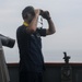 Sailors aboard the USS John Finn conduct a sea and anchor detail in Yokosuka, Japan