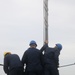 Sailors aboard the USS John Finn conduct a sea and anchor detail in Yokosuka, Japan