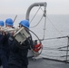Sailors aboard the USS John Finn conduct a sea and anchor detail in Yokosuka, Japan