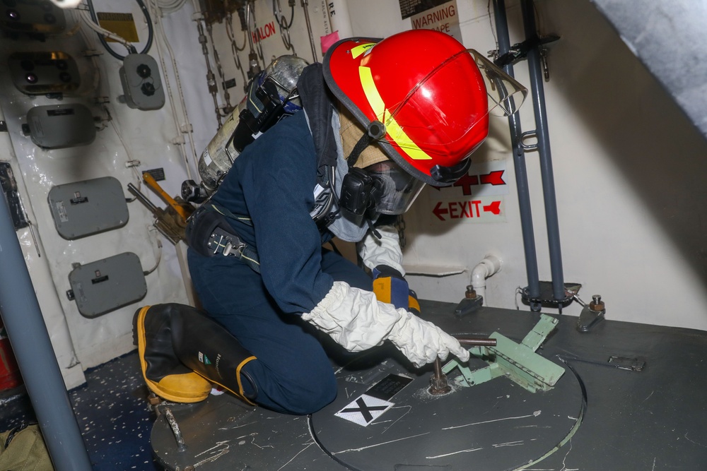 Sailors aboard the USS John Finn conduct a general quarters drill in Sagami Wan