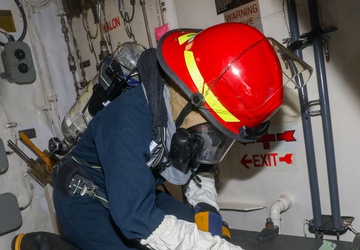 Sailors aboard the USS John Finn conduct a general quarters drill in Sagami Wan