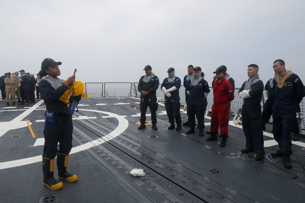 Sailors aboard the USS John Finn conduct a general quarters drill in Sagami Wan