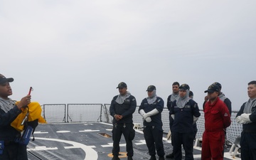 Sailors aboard the USS John Finn conduct a general quarters drill in Sagami Wan