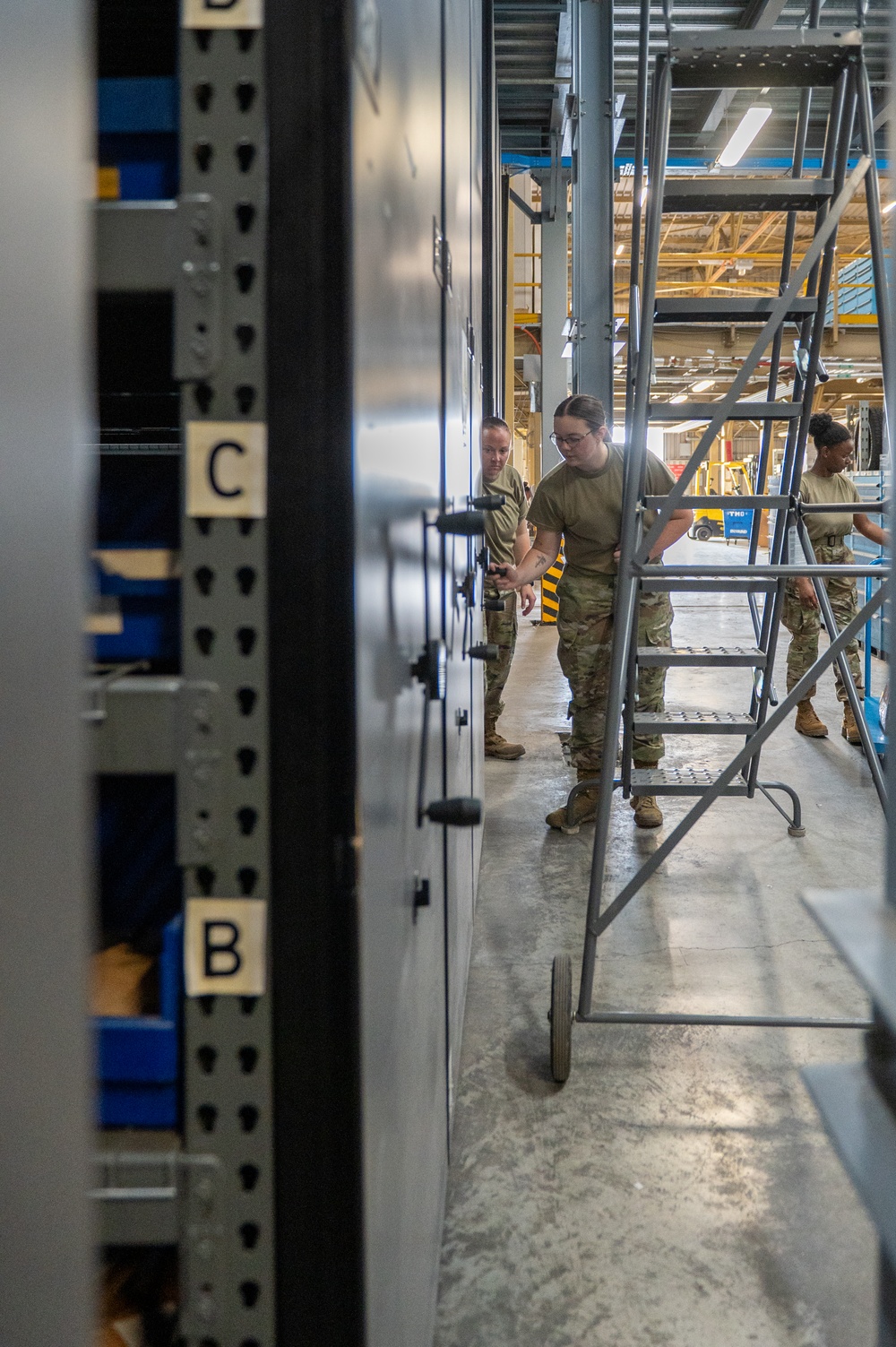 Airmen sort and organize incoming shipments