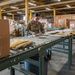 Airmen sort and organize incoming shipments