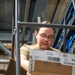 Airmen sort and organize incoming shipments