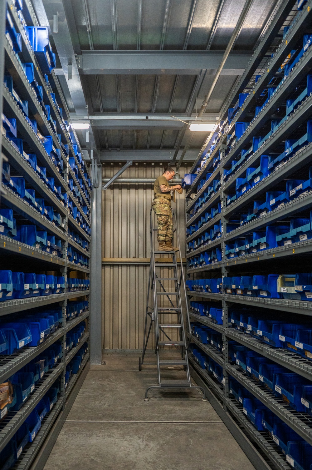 Airmen sort and organize incoming shipments