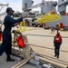 SN Samuel Ofori heaves a mooring line from the ship to the pier