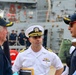 Commanding Officer Cmdr. Arturo Trejo meets with prospective Executive Officer Cmdr. Anthony LaVopa and Retired U.S. Navy Capt. Peter Bulkeley