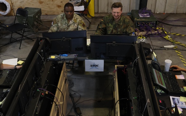 Allied planners use Virtual Joint Operations Center (VJOC) and the  Multi-Agent Virtual Environment (MAVEN) to track movements and communicate with units across the battlefield during Warfighter Exercise 25-4