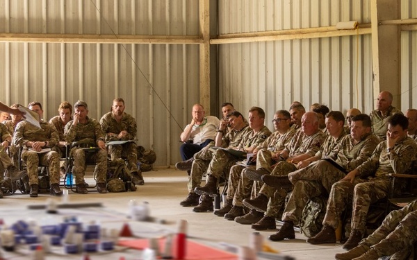 Members of 3rd United Kingdom Division conduct a rehearsal of concept drill during Warfighter Exercise 25-4