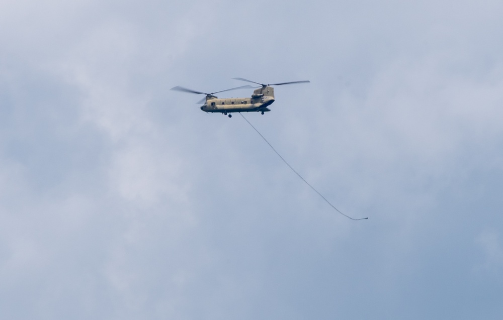 28th ECAB airlifts decommissioned Huey from mountaintop