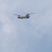 28th ECAB airlifts decommissioned Huey from mountaintop