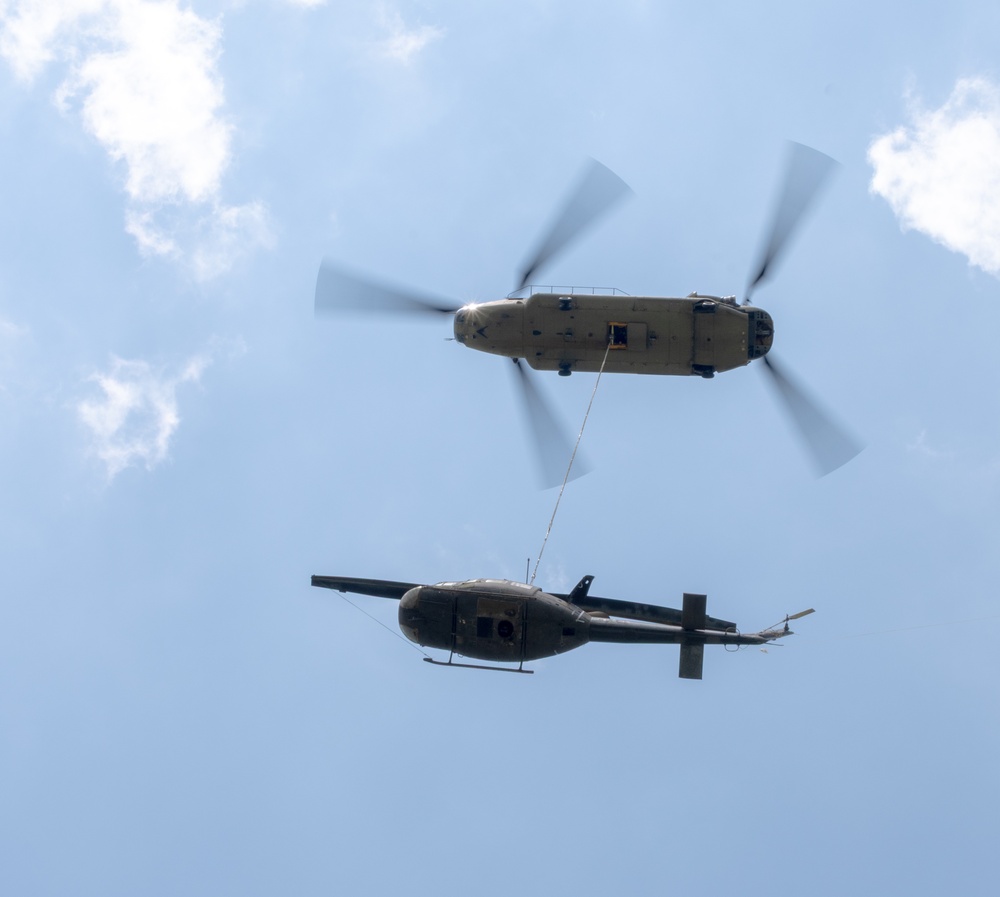 28th ECAB airlifts decommissioned Huey from mountaintop