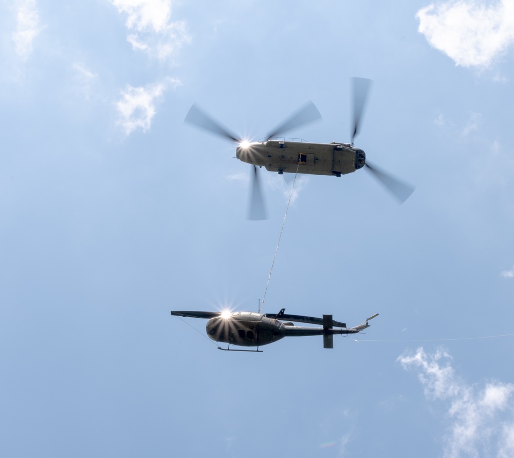 28th ECAB airlifts decommissioned Huey from mountaintop