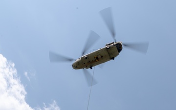 28th ECAB airlifts decommissioned Huey from mountaintop