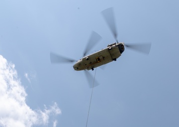 28th ECAB airlifts decommissioned Huey from mountaintop