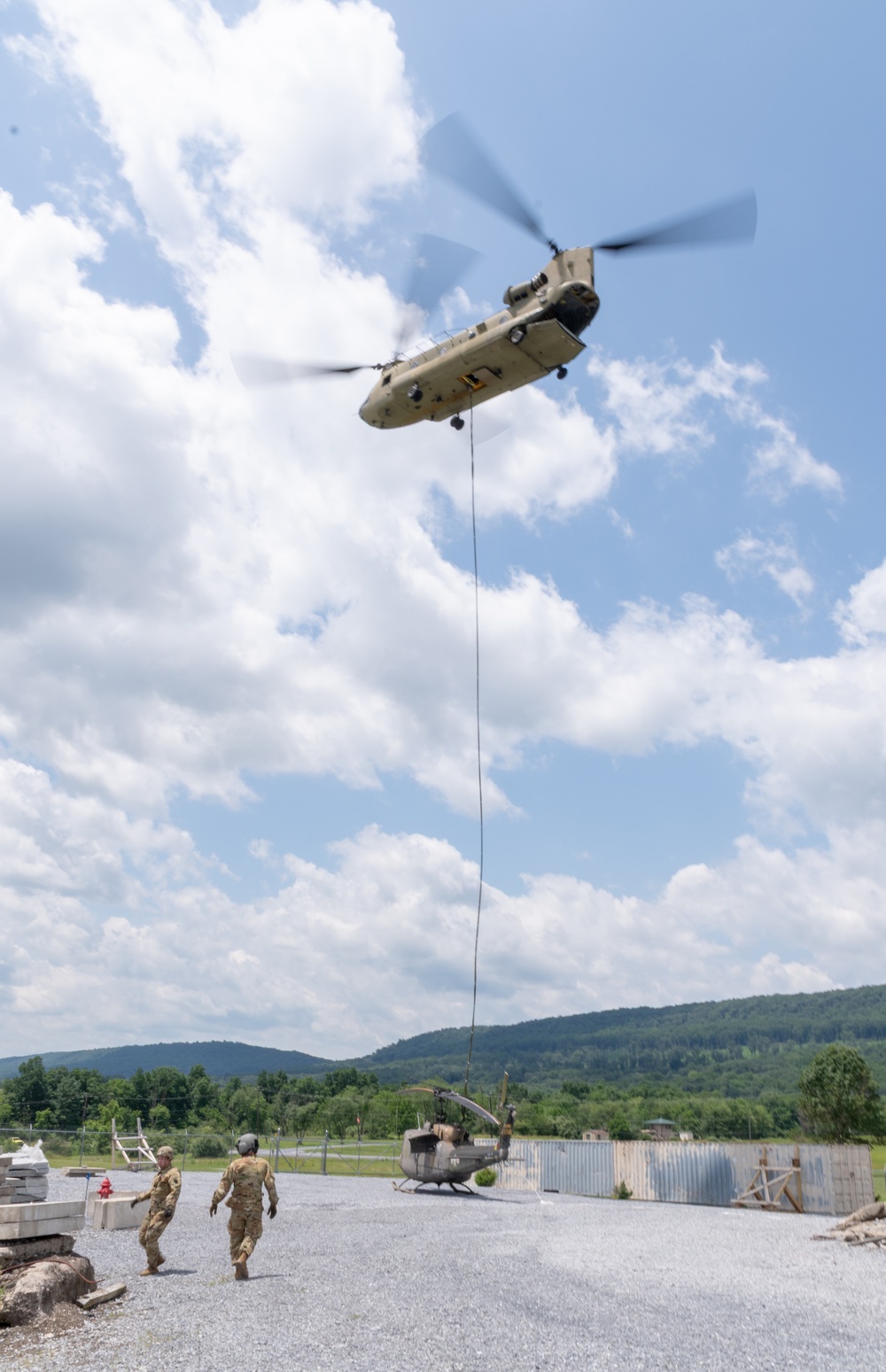 28th ECAB airlifts decommissioned Huey from mountaintop