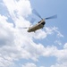 28th ECAB airlifts decommissioned Huey from mountaintop