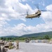 28th ECAB airlifts decommissioned Huey from mountaintop