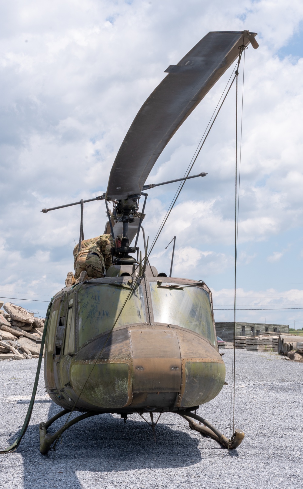 28th ECAB airlifts decommissioned Huey from mountaintop