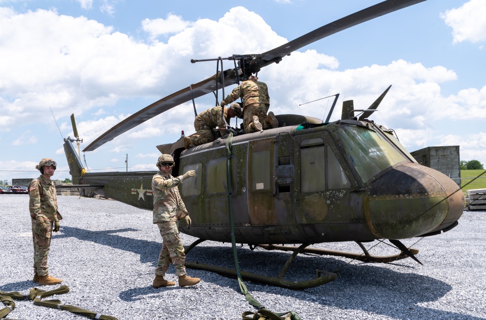 28th ECAB airlifts decommissioned Huey from mountaintop