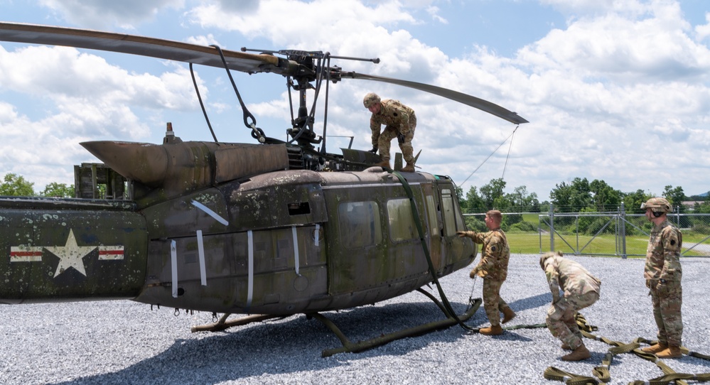 28th ECAB airlifts decommissioned Huey from mountaintop