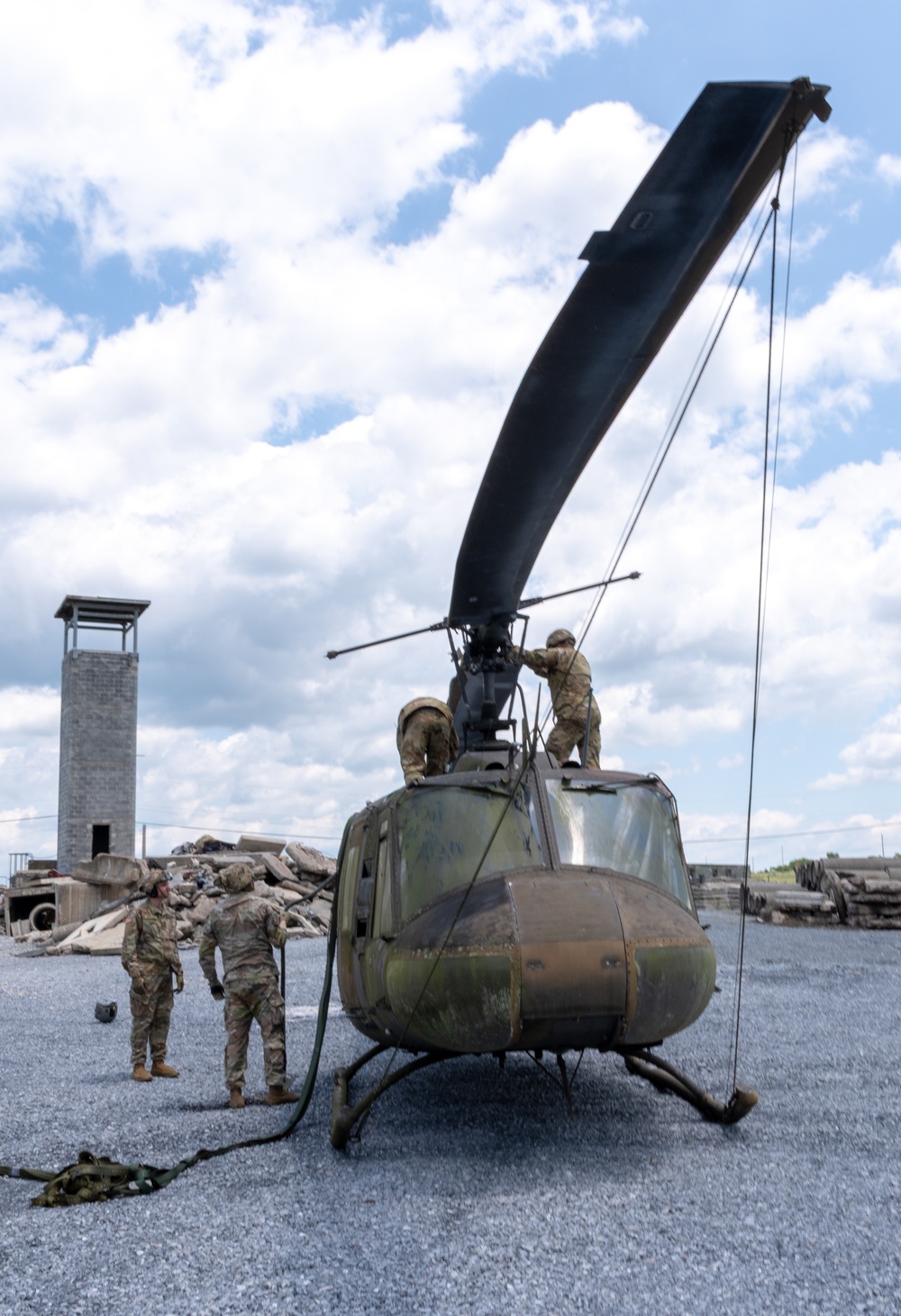 28th ECAB airlifts decommissioned Huey from mountaintop