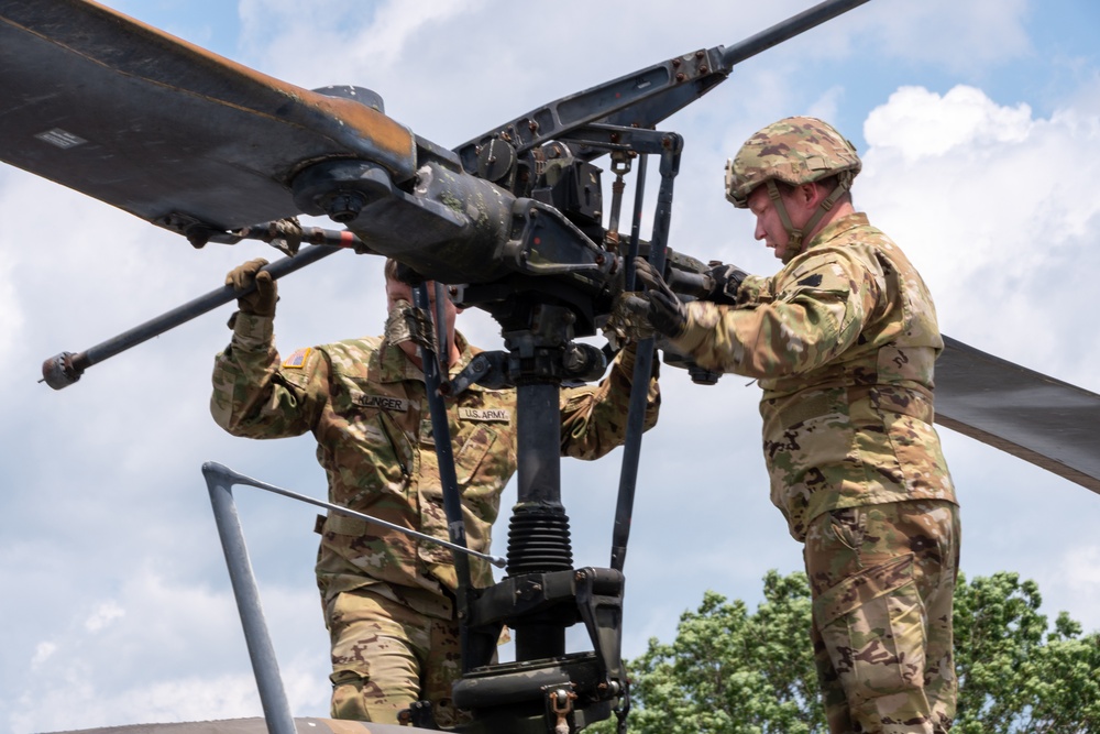 28th ECAB airlifts decommissioned Huey from mountaintop