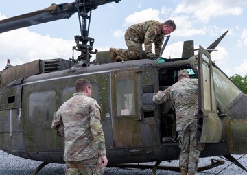 28th ECAB airlifts decommissioned Huey from mountaintop